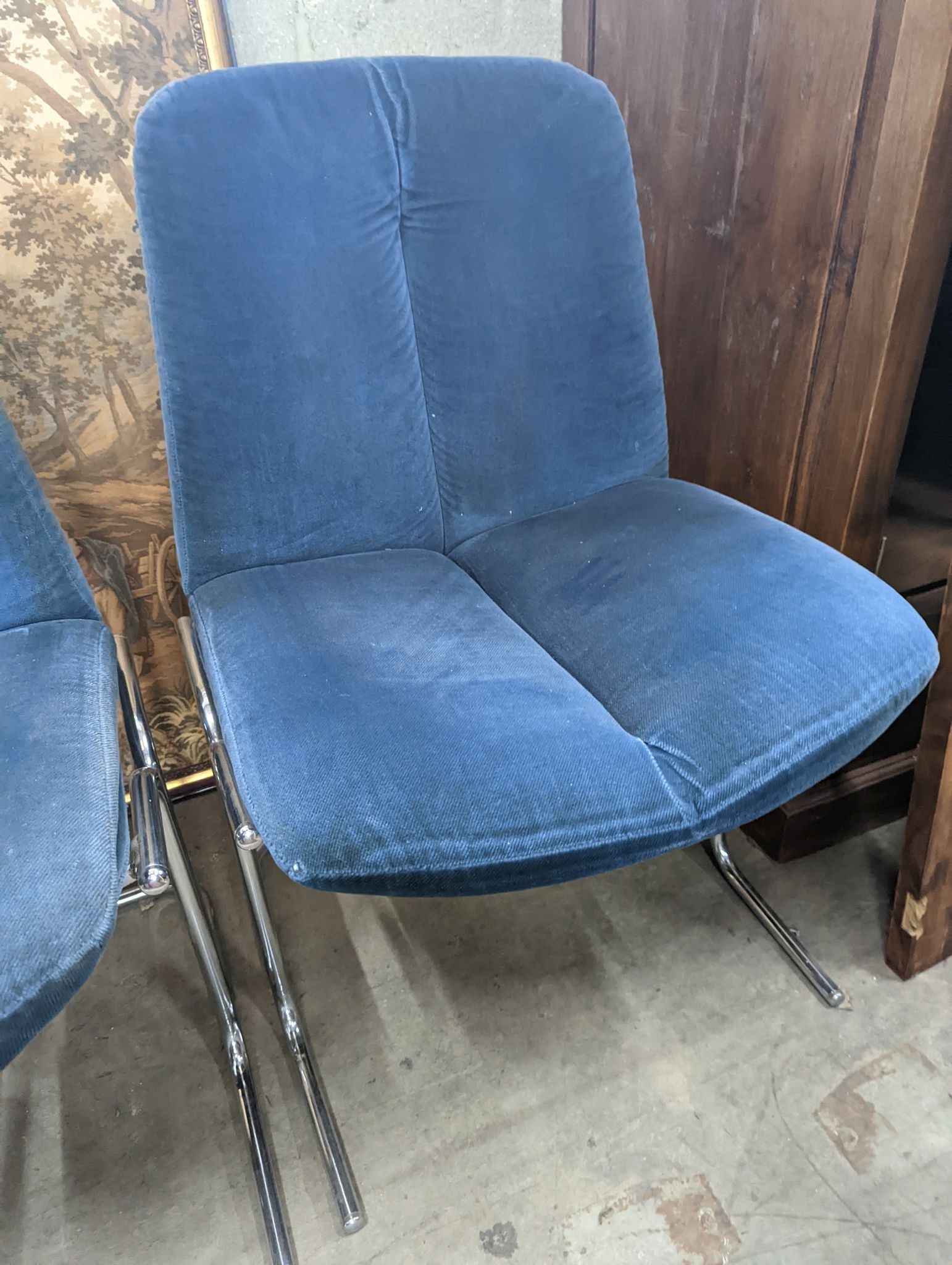 A pair of mid century blue fabric dining chairs